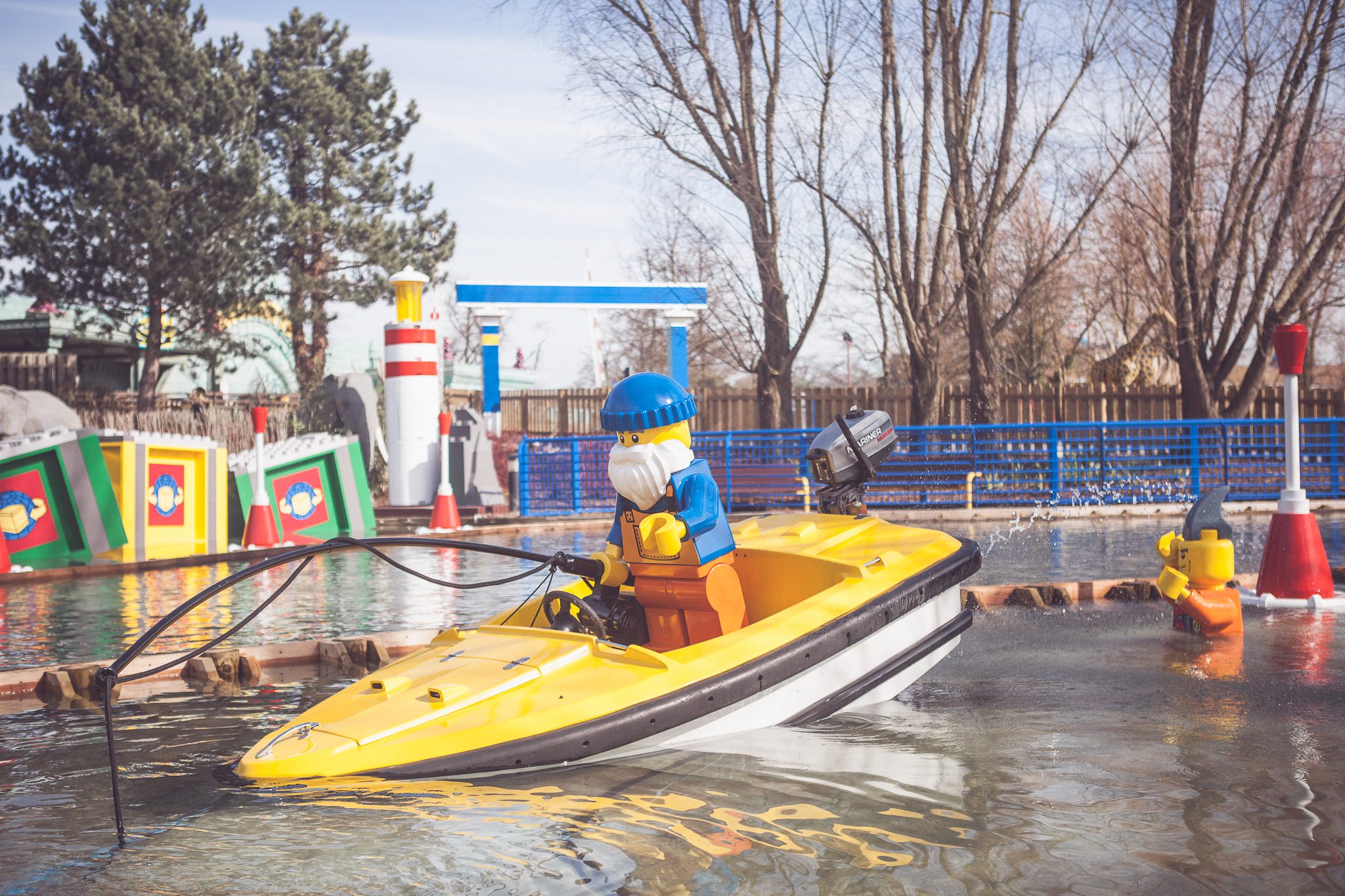 A water LEGO themed ride area with a yellow LEGO boat