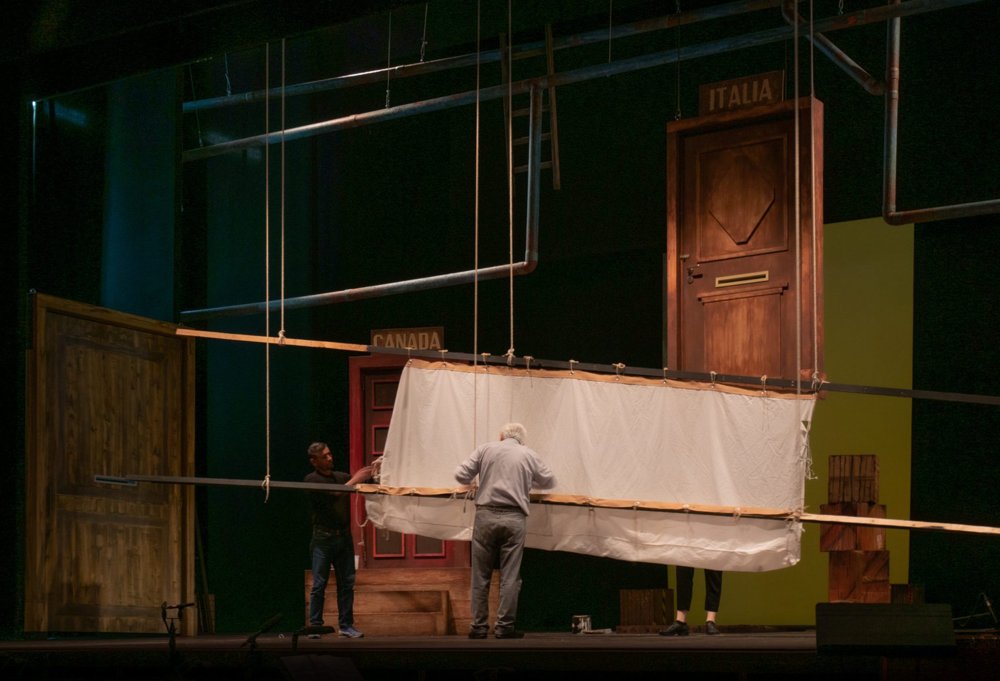2 Set workers preparing a theatre stage