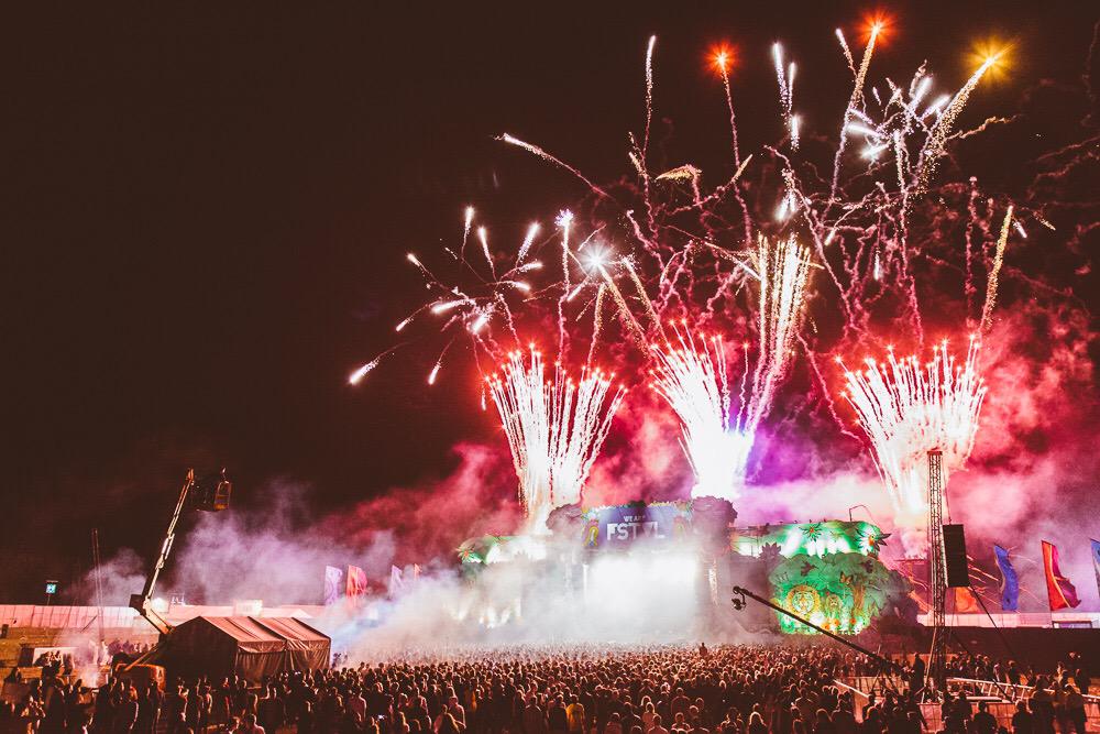 We Are Fstvl crowd with fireworks at night