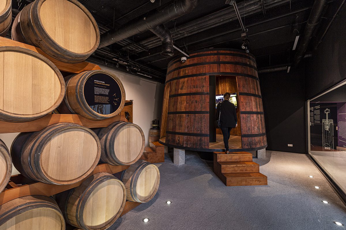 A room of barrels with a person walking into one of the barrels