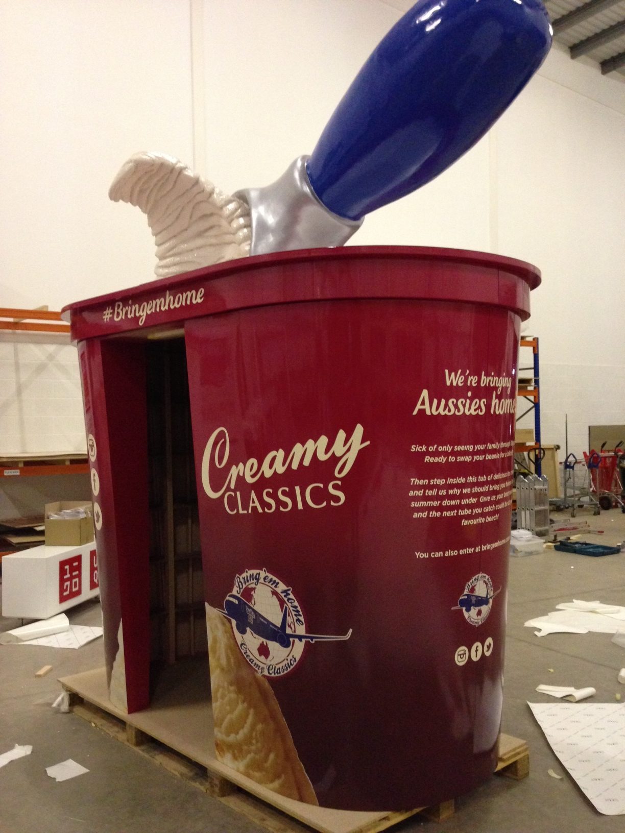 A large sculpture of a tub of ice cream in a red tub