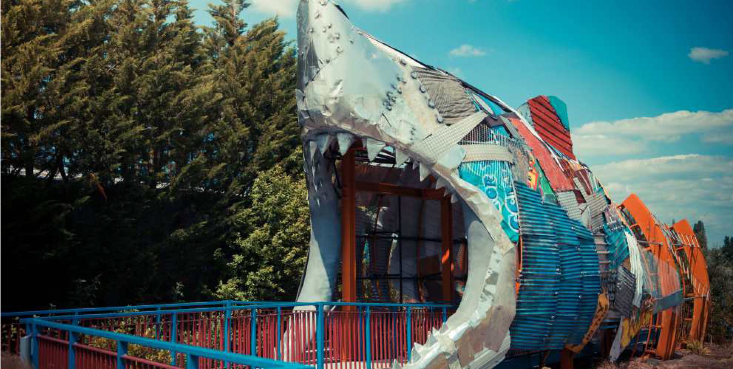 The entrance to the Thorpe Shark Hotel with a sculpture of a shark mouth
