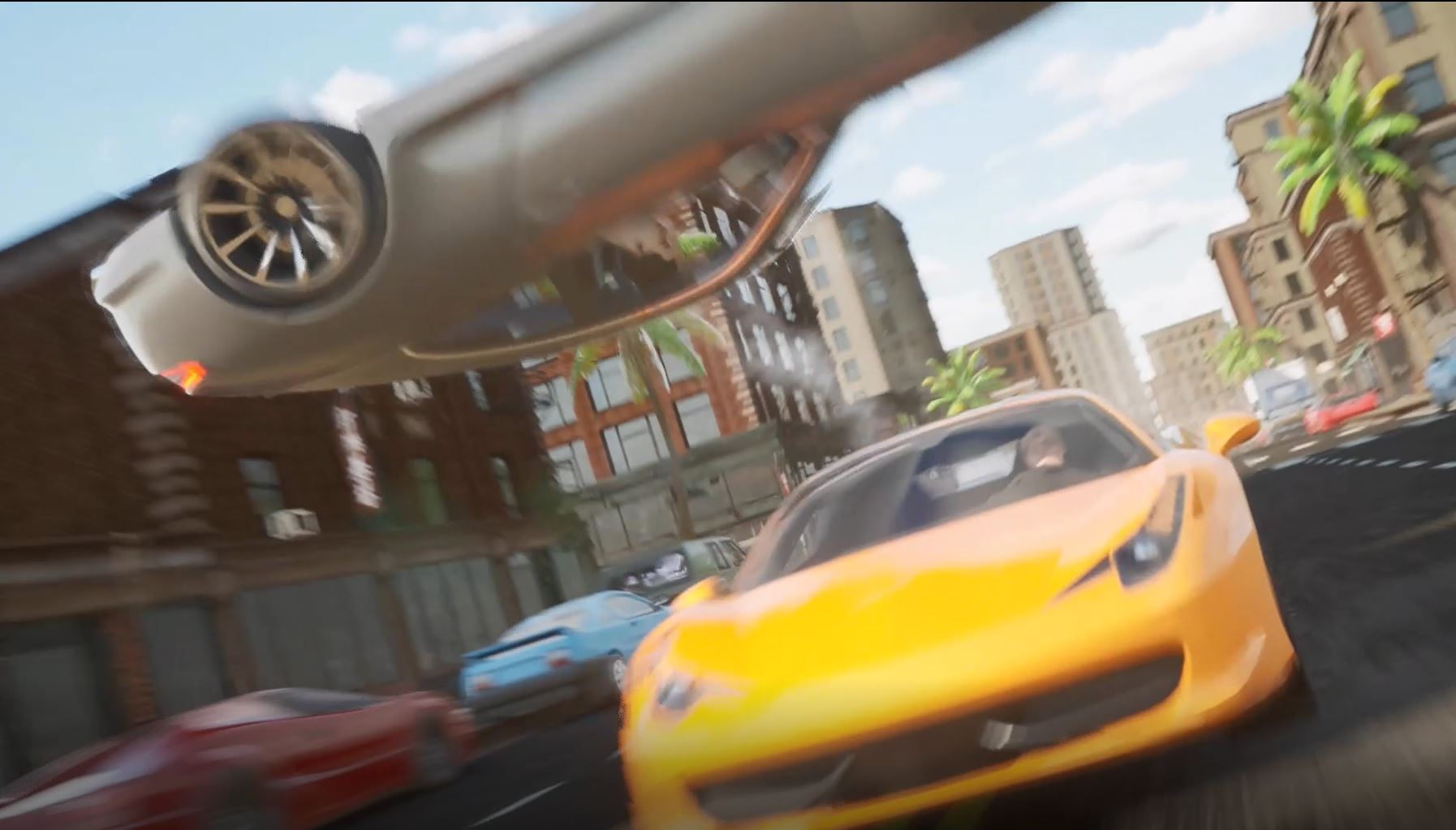 A blurred Image of a yellow car with a grey car above flying in the air